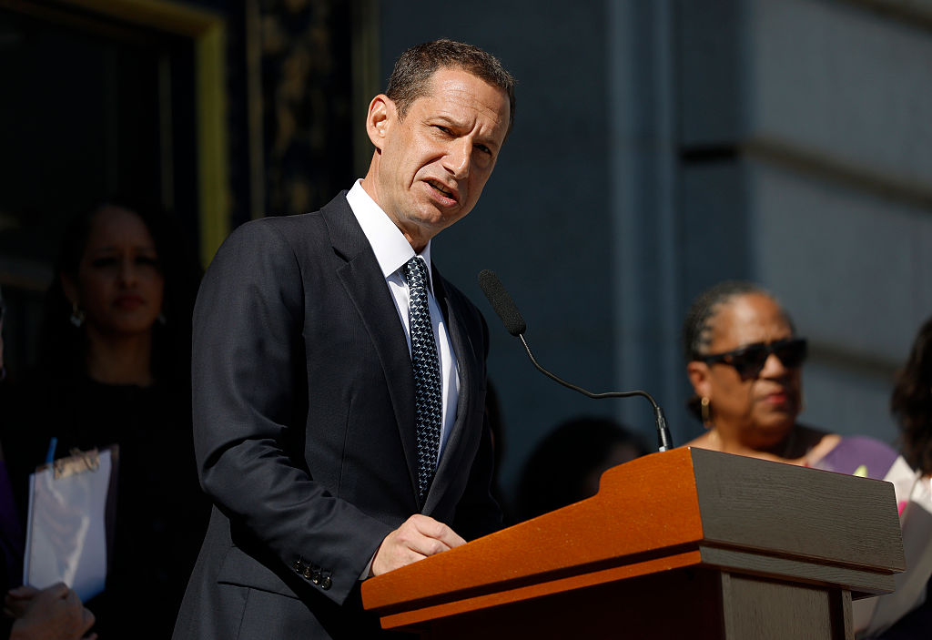 San Francisco skyline at sunset with City Hall in the foreground